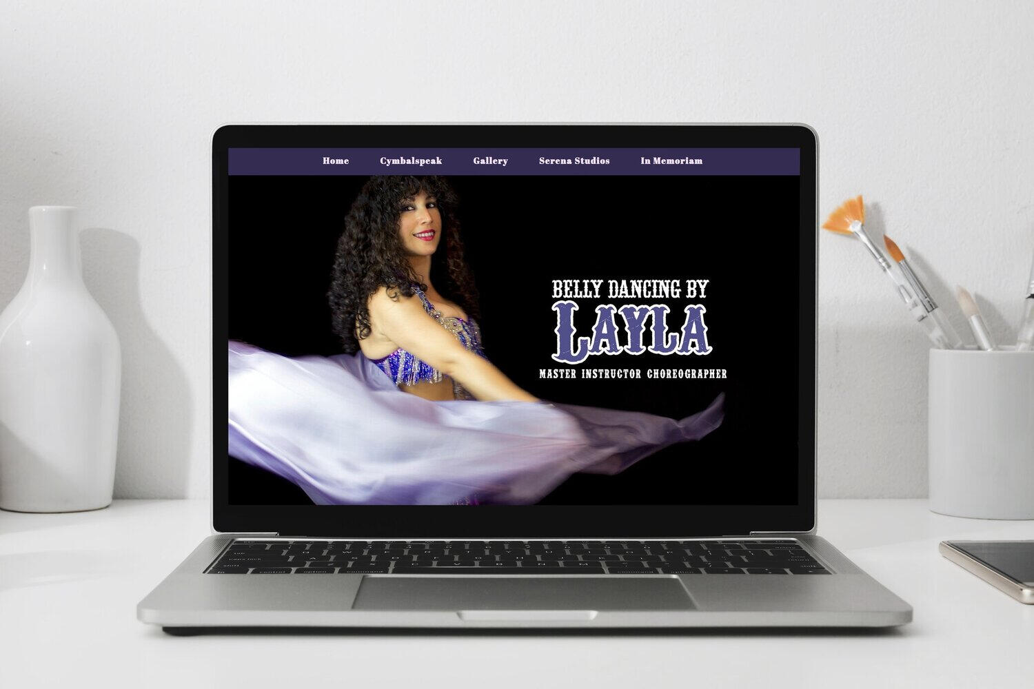 Belly Dancing by Layla A laptop screen showing Bellydancing by Layla's homepage.
